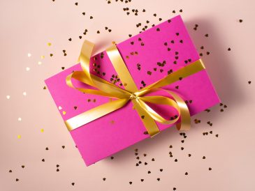 pink gift box with yellow ribbon