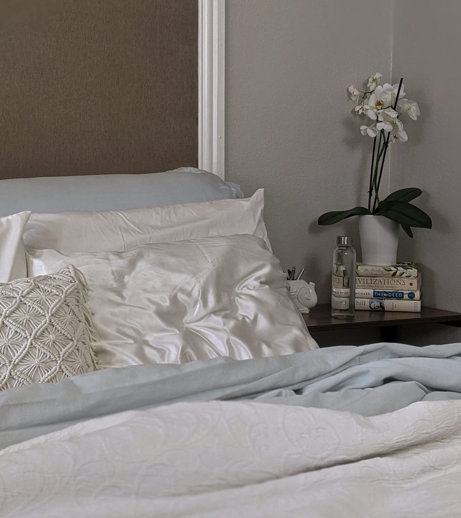 white and gray floral bed linen